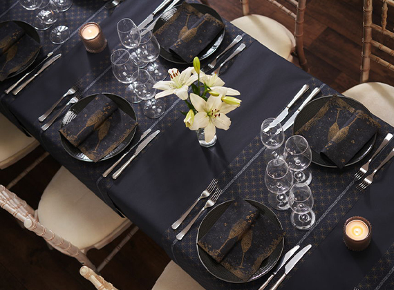 Formal banquet table set with celebrate napkin design