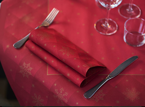 Holiday table setting with bordeaux and gold napkin, festive tablecloth and glassware, designed for restaurants, hotels and more.